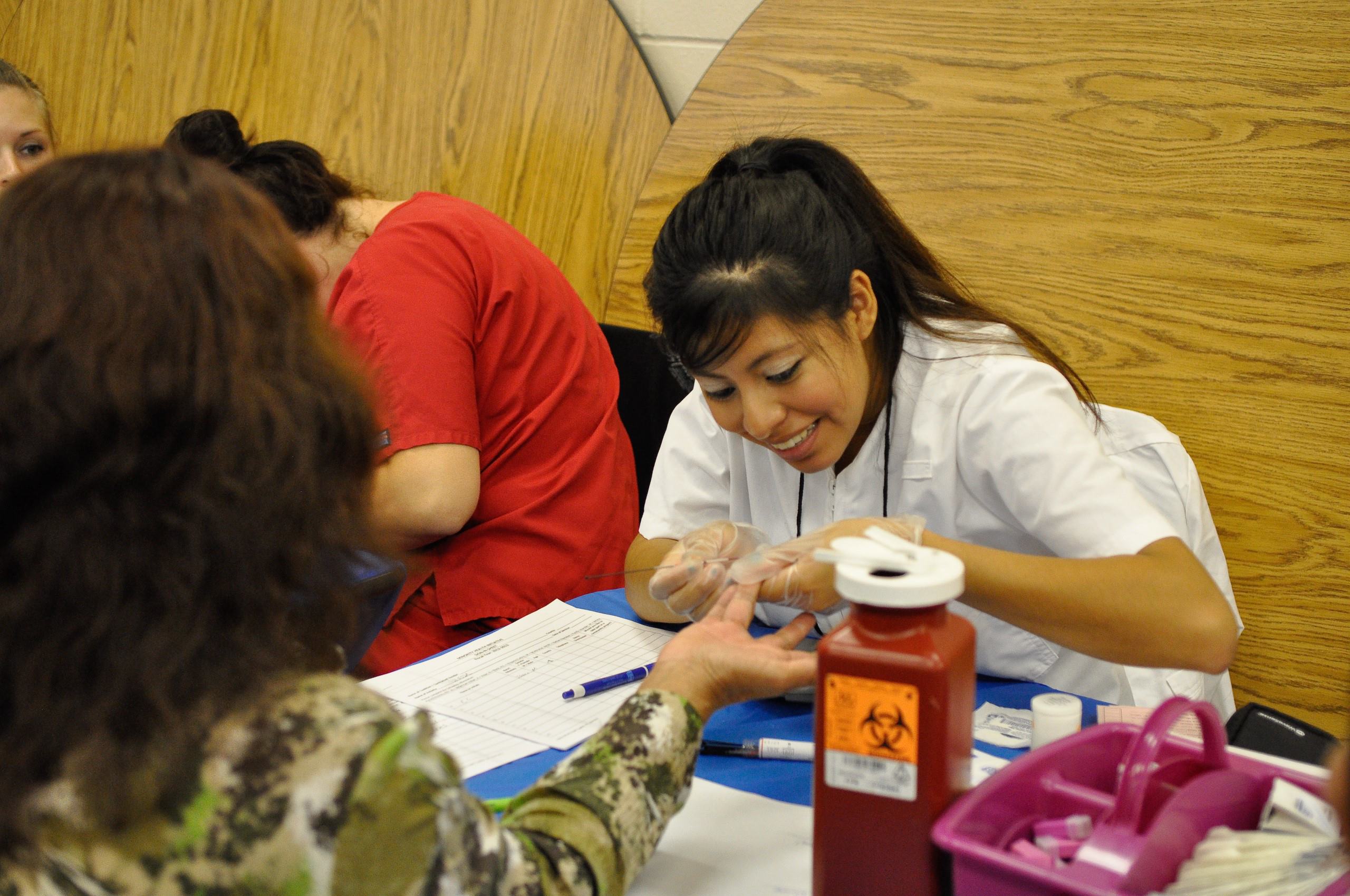 NIHHC health fair volunteer giving care